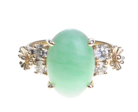 A diamond and jade dress ring
The central cabochon-cut jade flanked by four brilliant-cut diamonds and two gold flowers, set 