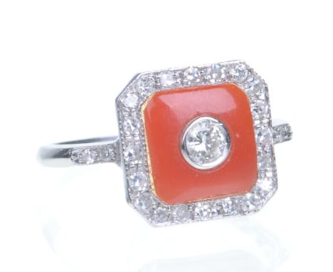 A diamond and coral plaque ring
Art Deco style, the central round brilliant-cut diamond to a coral panel, set to a single-cut