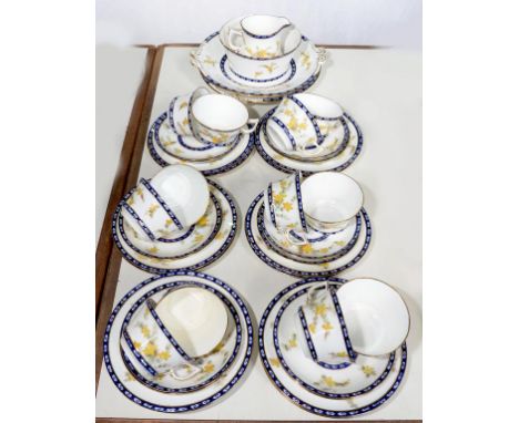 A STAFFORDSHIRE BONE CHINA FLORAL TEA SERVICE WITH BLUE AND GILT BORDERS, EARLY 20TH CENTURY