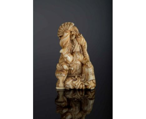  A netsuke depicting a group with Samurai and a seated man signed by Masa MoriJapan, 19th century Cm 4,50 22.00 % buyer's pre