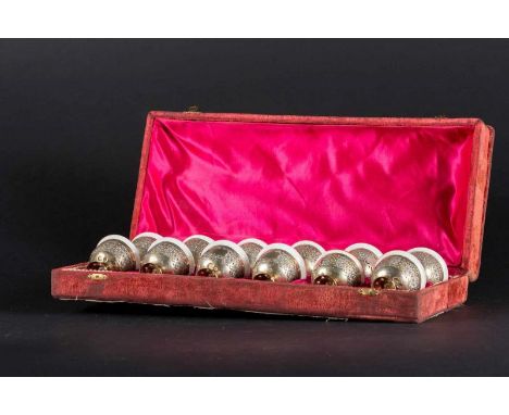  Twelve zarfs in European porcelain and Ottoman silver setting with Sultan Abdulhamid II (r. 1876 - 1909) tughra in a velvet 