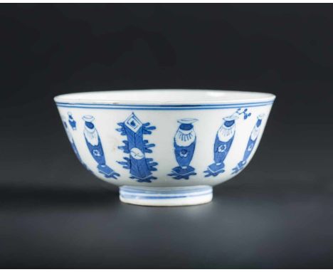  A blue and white porcelain bowl painted with antiques and bearing a mark at the base China, Qing dynasty, 19th century Cm 12