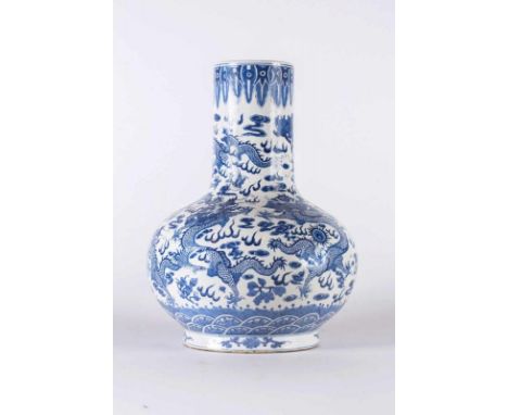  A big blue and white porcelain vase painted with dragons chasing the flaming pearl among clouds and bearing a Qianlong mark 