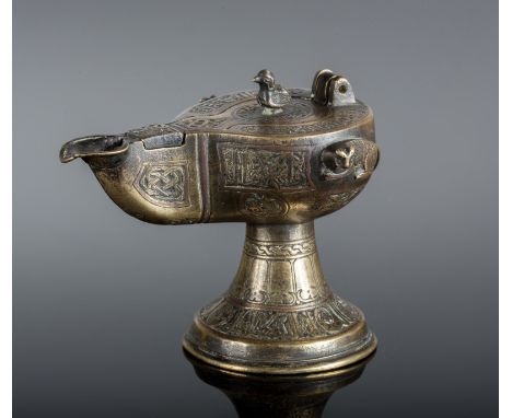  A small oil lamp with silver and copper inlay Seljuk Iran, XII secolo Cm 11,00 x 9,00 22.00 % buyer's premium on the hammer 