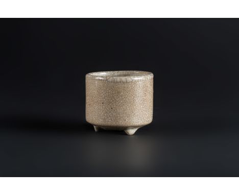  A porcelain geyao glazed tripod brush pot China, Ming dynastyThe base left unglazed and covered with a black patina, the res
