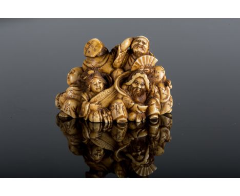  An ivory netsuke depicting the Fortune godsJapan, 19th century Cm 4,50 x 3,50 22.00 % buyer's premium on the hammer priceVAT