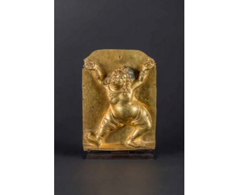  An embossed gilt copper plaque with semi-wrathful figureTibet, 16th - 17th century Notable rectangular plaque, embossed with