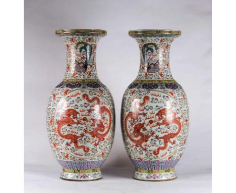  A pair of massive porcelain vases enamelled with dragons chasing the flaming pearl and phoenixes in clouds China, Qing dynas