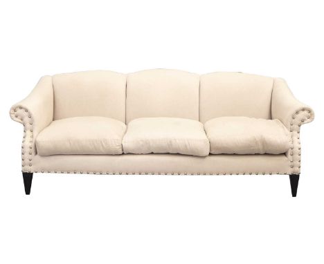 A contemporary triple camelback three-seat sofa, with oatmeal herringbone silk stuff over upholstery and decorative dome stud