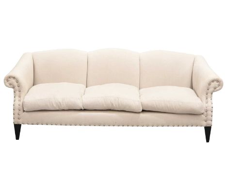 A contemporary triple camelback three-seat sofa, with oatmeal herringbone silk stuff over upholstery and decorative dome stud