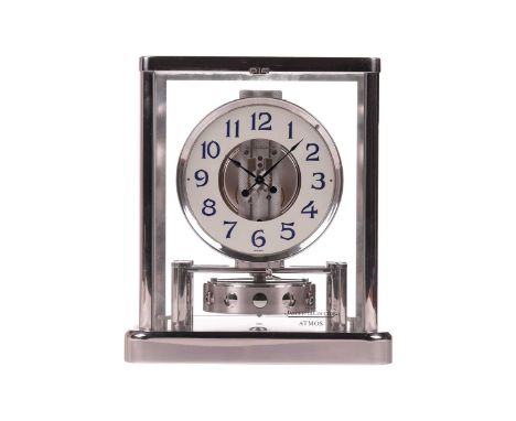 A Jaeger Le Coultre Rhodium plated Atmos 'Classique' mantel clock, the circular dial bearing Arabic Numerals in blue, serial 