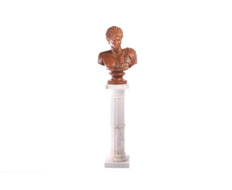 After the antique, a large terracotta bust of Hermes, on an integral socle, 57 cm x 39 cm, together with an associated marble