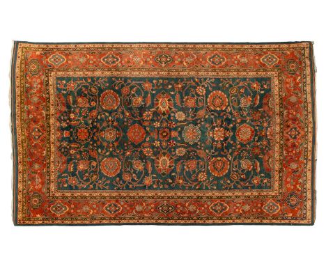 A large Ushak Carpet, the red palmette and leaf design on a blue/green field, within a light red border, 417 x 271 cmOverall 