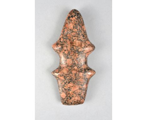 An American stone axe head Kent County, Michigan with a flat end and a pointed end with a waisted centre, with a hand written