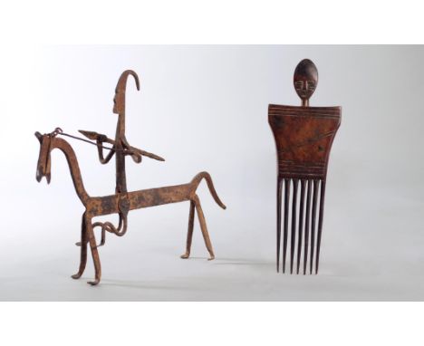 An Ashanti comb Ghana with a head finial, 23cm high, and a Nigerian iron equestrian figure, 21.5cm high. Provenance The eques