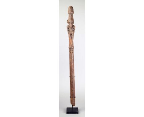 A Sepik River staff finial Papua New Guinea wood with an ancestor figure and Janus head terminal, on a broken shaft with coll