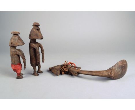 A Timor spoon Indonesia wood and coconut shell, the finial carved a female bust, 27cm long, and a pair of Timor male and fema