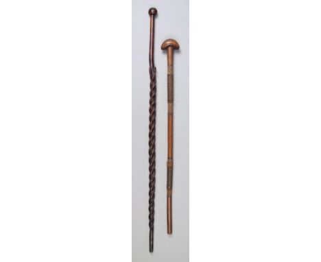 A Zulu staff South Africa the shaft with three entwined snakes, two with incised dot decoration, with a spherical finial, 91c