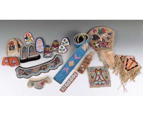 A pair of Iroquois beaded vamps on velvet with glass and metal floral decoration, the wide ends with metal beaded text, 14cm 