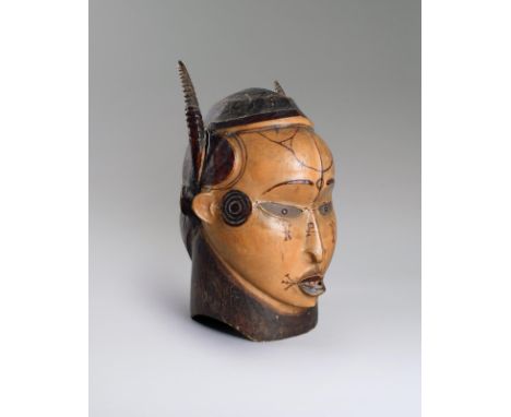 An Ejagham Janus helmet mask Nigeria hide covered and with a pair of spiral wood horns, the lighter face with painted symbols