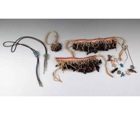 A pair of North American dance anklets hide with red and white glass beads and with fringes hung with deer hooves, 65cm and 6