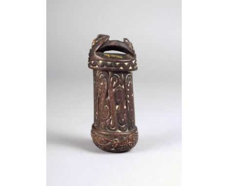 A Massim betel nut mortar Kiriwina Islands, Papua New Guinea the base with a loop handle having pierced fins with a scroll ca