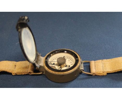 Post war RAF wrist compass on original canvas strap bearing broad arrow mark, Ref No. 6B / 2593 Serial No 24910 B/66, 35mm di