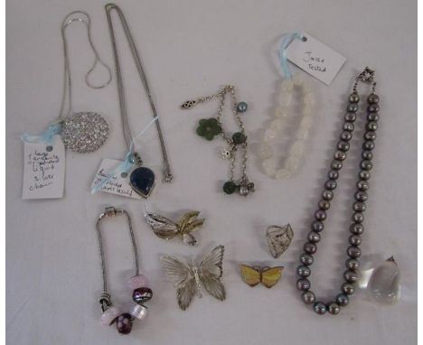 Silver mounted jewellery includes Tourmaline pendant, , Rhona Sutton charm bracelet , lapis lazuli pendant with necklace, tan