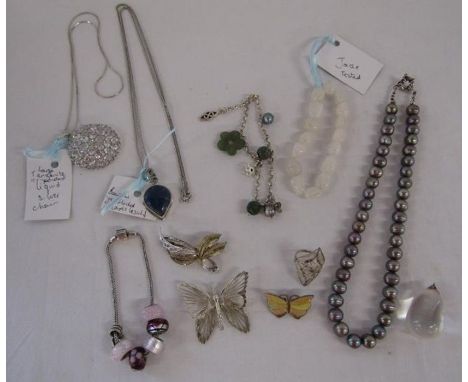 Silver mounted jewellery includes Tourmaline pendant, , Rhona Sutton charm bracelet , lapis lazuli pendant with necklace, tan