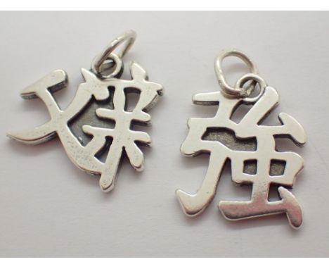 Two sterling silver Chinese symbol pendants ( father and strength )