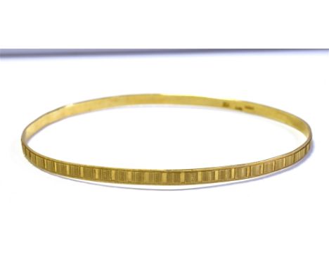 9CT GOLD BANGLE 3.2mm wide engraved bangle, hallmarked Sheffield 1977.  Weight 4.7 grams.