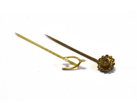 GOLD &amp; GEM SET STICK PINS one mounted in 15ct gold, star grain set with a senaille cut diamond and one in 14ct gold, with