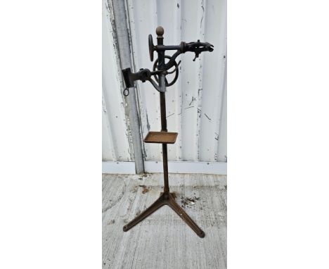 A Millennium cast iron two bicycle stand with tool tray 