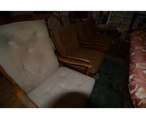 A 1970's/80's Parker Knoll modernist sitting room suite comprising a two seater sofa and two armchairs, each with slatted bac