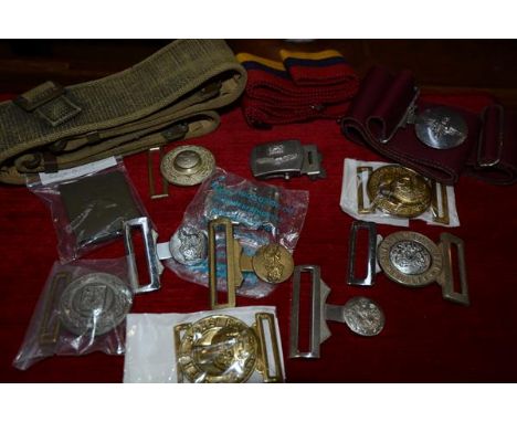A group of military belt buckles including a Royal Army Medical Corps with canvas belt, Parachute Regiment with canvas belt, 