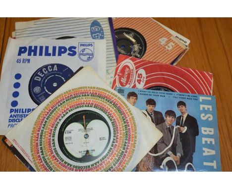 A group of approximately twelve Beatles and Rolling Stones 45's including two French Odeon, Parlophone etc