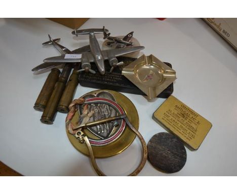 A group of World War II model aeroplanes, souvenir shells, tins and ashtrays