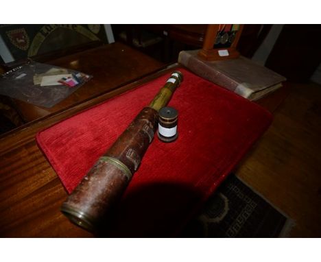 A brass four draw telescope, Broadhurst Clarkson & Co,, 63 Farringdon Road, London E.C., in a stitched leather sleeve.