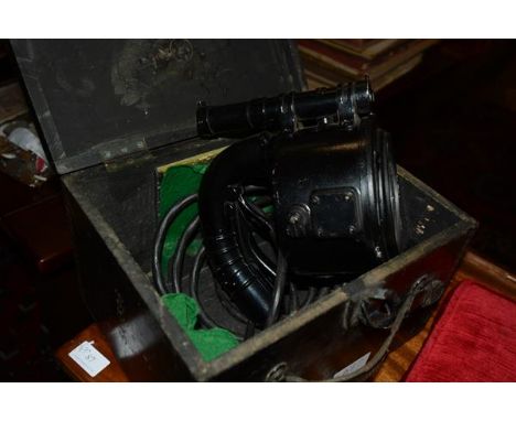 A World War II era Aldis signalling lamp, in its original wooden box, the label dated 1941