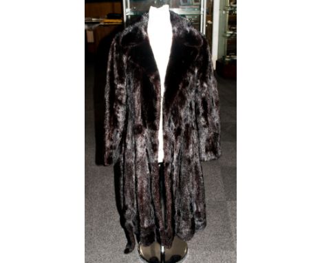 Dark Brown Full Length Mink Coat, fully lined. Half back belt. Slit pockets. Collar with revers. Hook & Loop Fastening