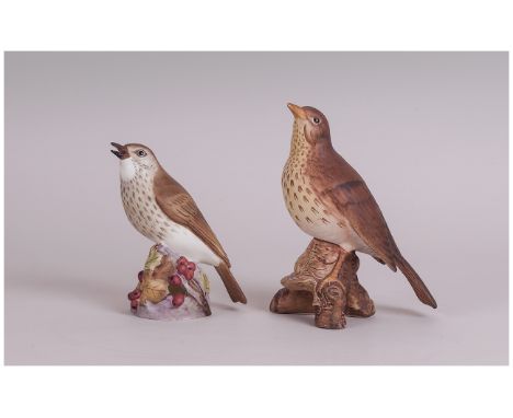 Royal Worcester and Beswick Thrush Figures, the Royal Worcester, 4.5 inches high, showing the bird on a branch of green and y