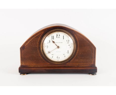 A 1920's Oak Cased 8 Day Mantle Clock raised on 4 circular brass feet with white porcelain dial and string inlay to front of 