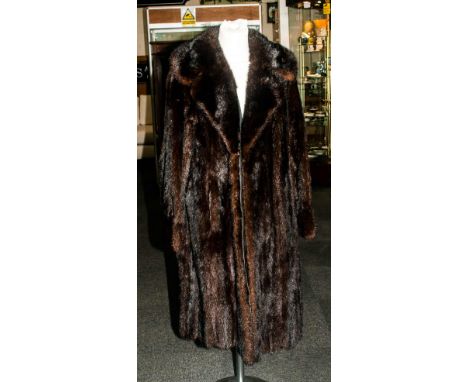 Ladies Three Quarter Length Dark Brown Mink Coat, fully lined. Slit pockets. Collar with revers.