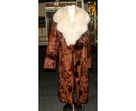 Ladies Full Length Dark Brown Pony Hide Coat with fox fur collar. Fully lined. slit pockets,
