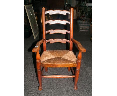 Small 19thC Ladder Back Child's Chair with angular arms, step ball feet and rush seat. c 1880. 30 inches high.