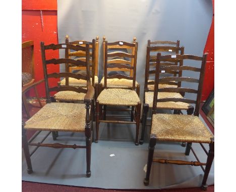 A harlequin set of eight ladder back chairs having rush seats including one carver chair