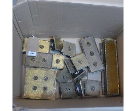 A collection of brass light sconces. 