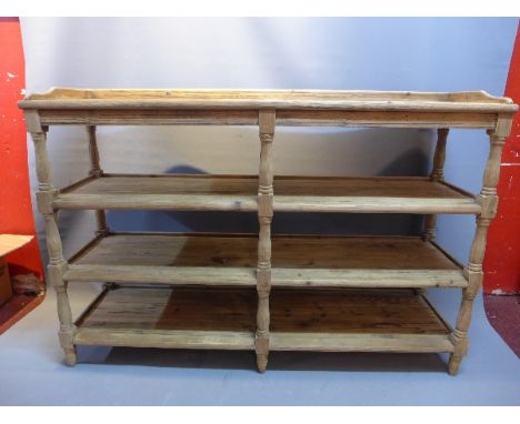 A reclaimed pine three tier book shelf with baluster supports, H:95cm W:140cm D:41cm