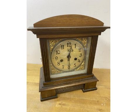 An early to mid 20thc mahogany mantel clock of architectural form, the metal dial with arabic numerals, measures 31cm x 25cm 