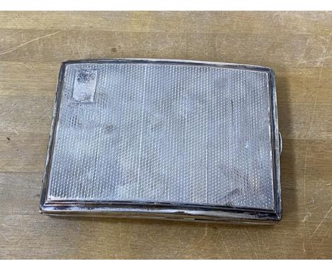 A 1928 Birmingham silver cigarette case with engine turned exterior, weighs 140 grammes